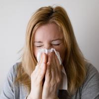 Woman Sneezing