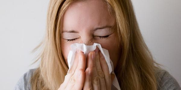 Woman Sneezing